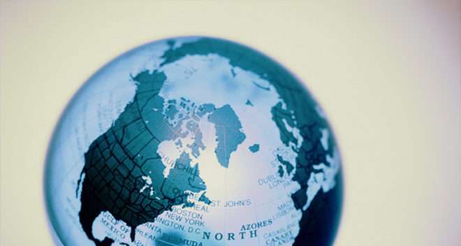 A world globe on a blue background.